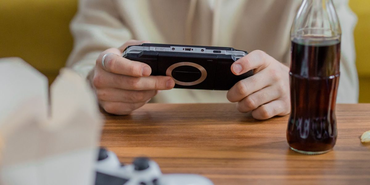 A person setting up gaming equipment to prepare for a team building session.